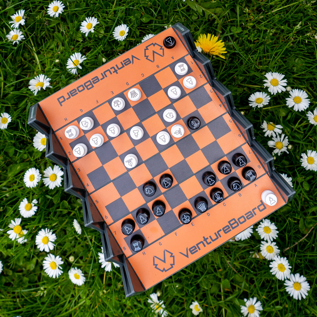 a travel chess set with pieces in gameplay